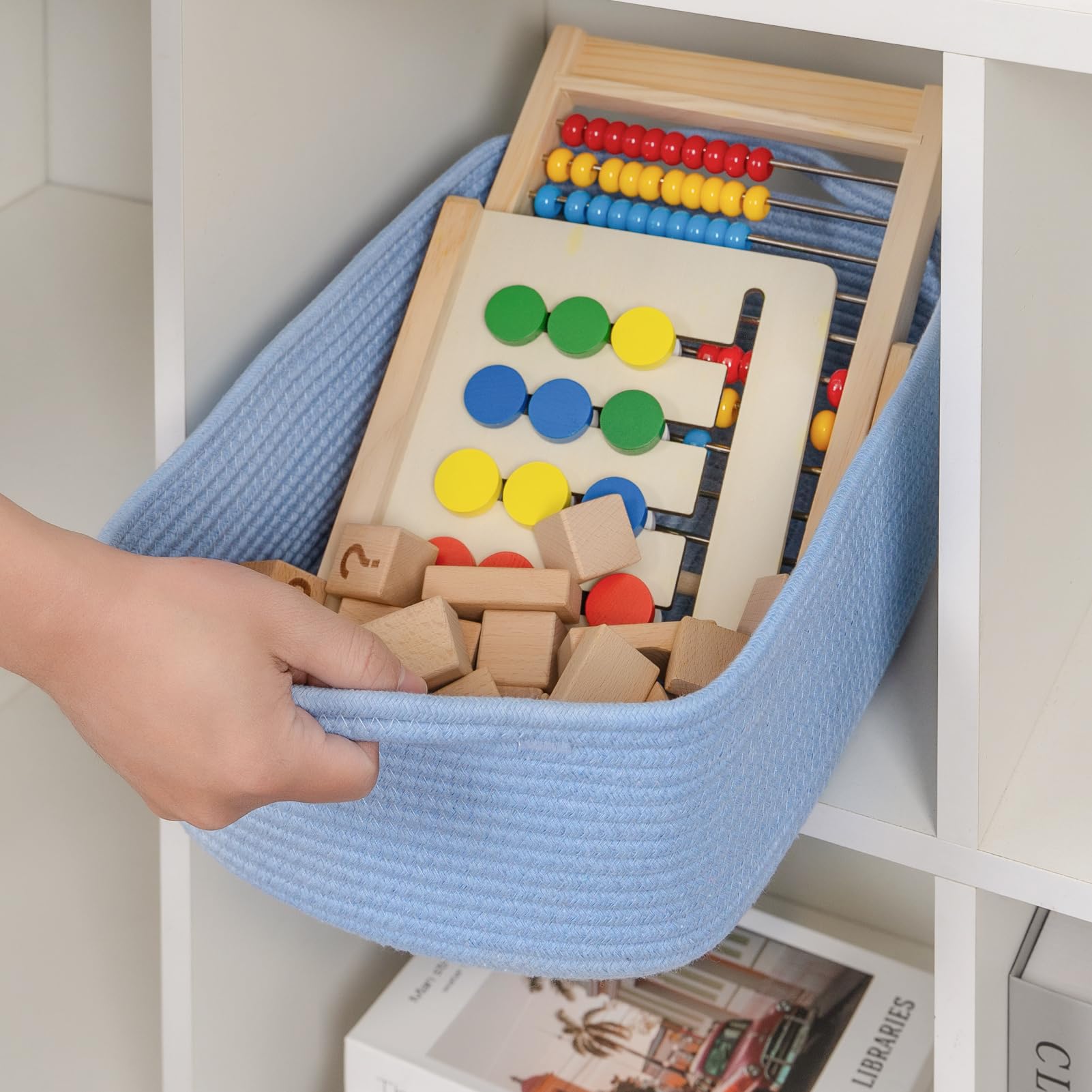 CubesLand basket on a shelf, blue hue complements decor while organizing.