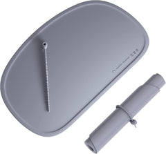 Cuddle Campus silicone placemat with raised edges to contain spills during family meals.