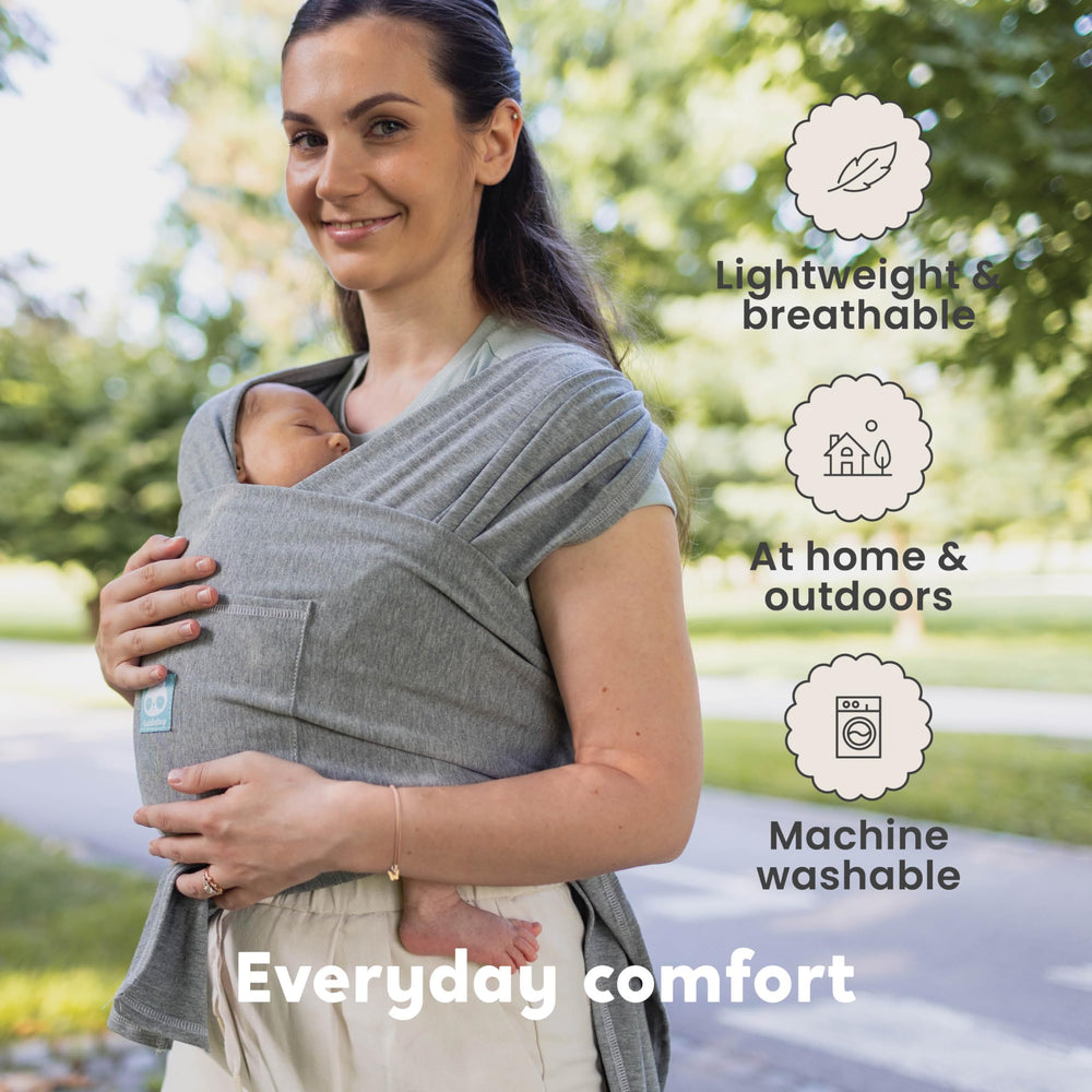 CuddleBug CuddleCarry hands-free carry shown during chores or errands