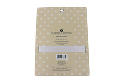 Cudlie Buttons & Stitches hooded towels folded for compact storage and easy access