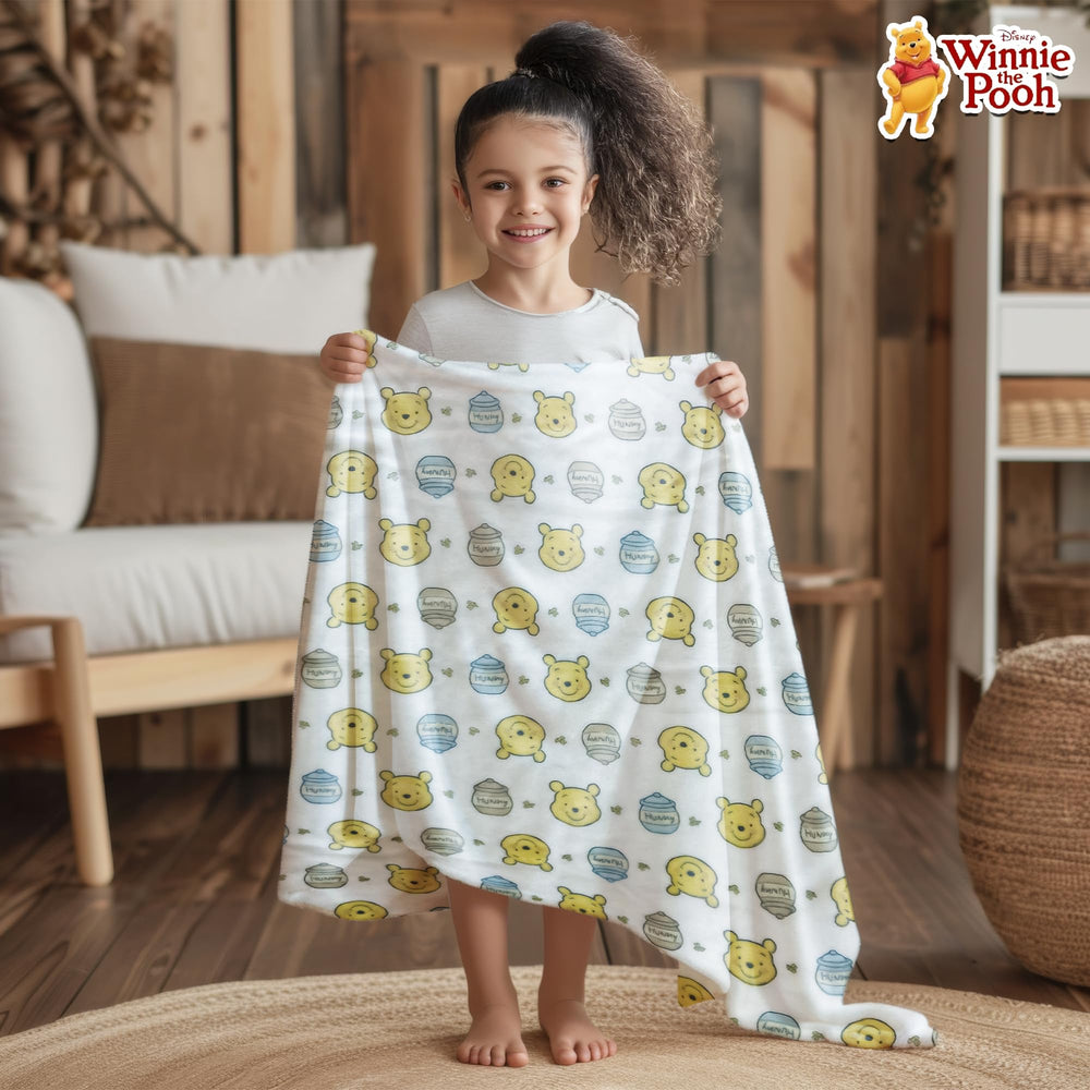 Cudlie Winnie the Pooh blanket durable fleece stays soft through everyday use.