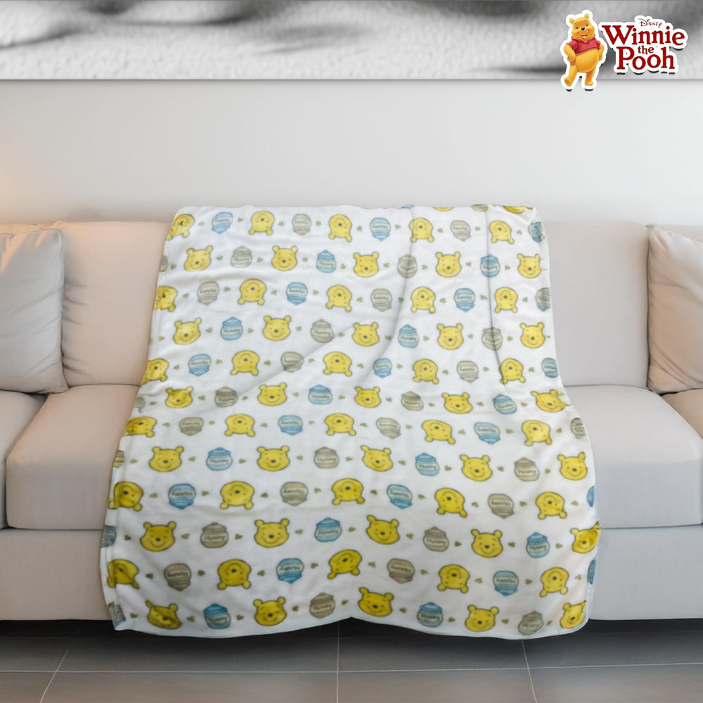 Cudlie Winnie the Pooh blanket stroller-friendly for lightweight warmth on the go.