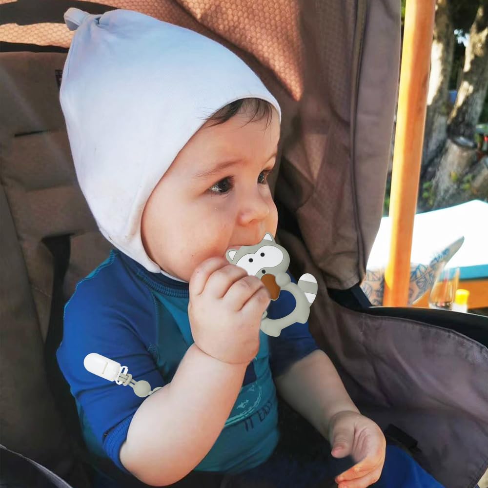 Cuebo freezer-safe teether gray raccoon can be cooled for comfort.