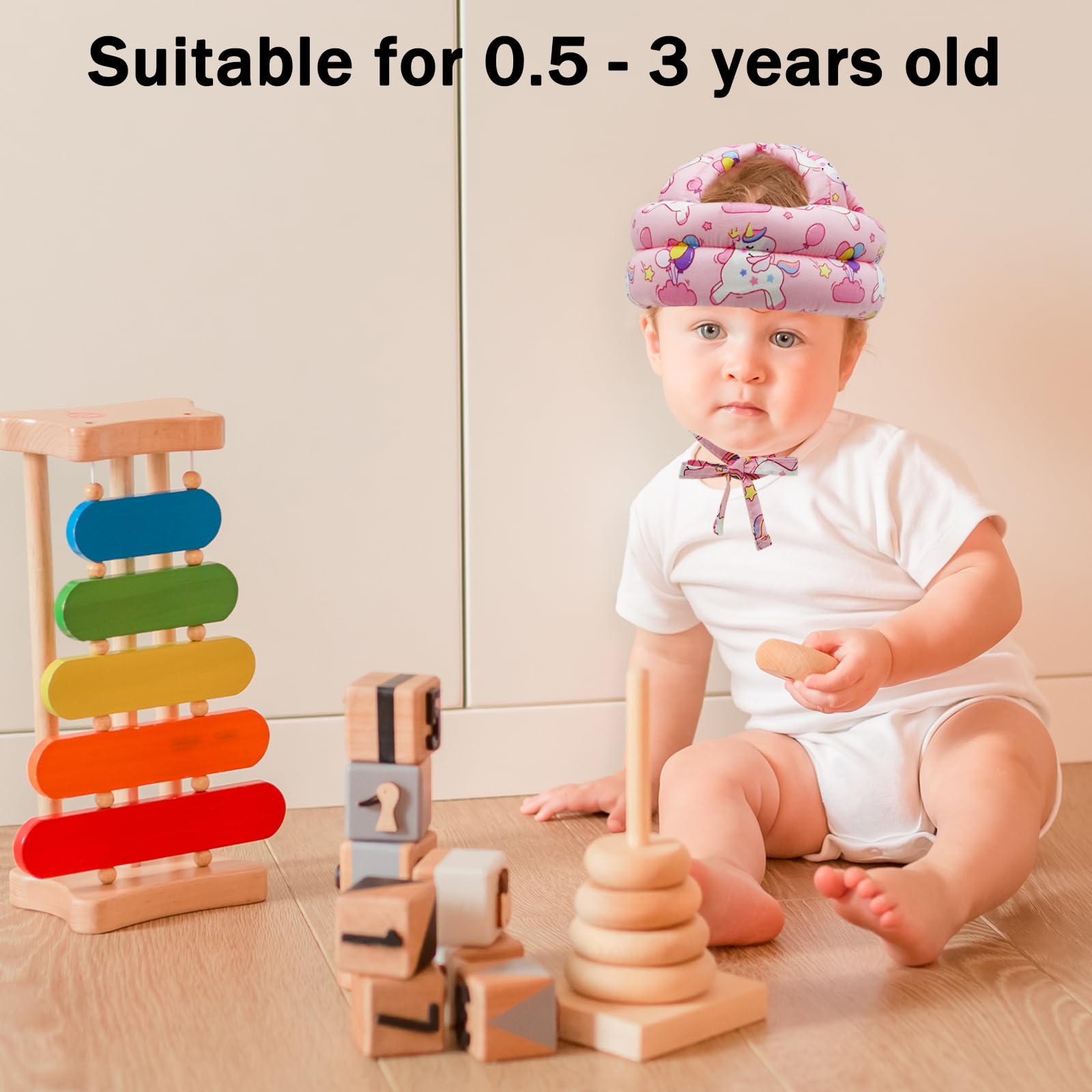 CUXFLS Unicorn baby wearing helmet for comfortable protection during play.