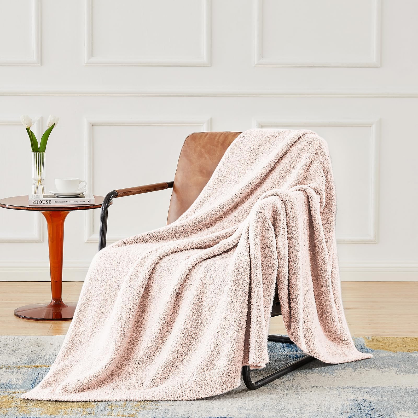 CYMULA pink baby blanket draped on a crib for nap-time warmth.