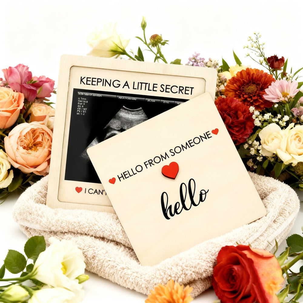 Close-up of the premium wood frame with secure lid protecting the ultrasound image.