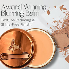 Danessa Myricks Yummy Skin Blurring Balm Powder texture close-up showing smoothing action.