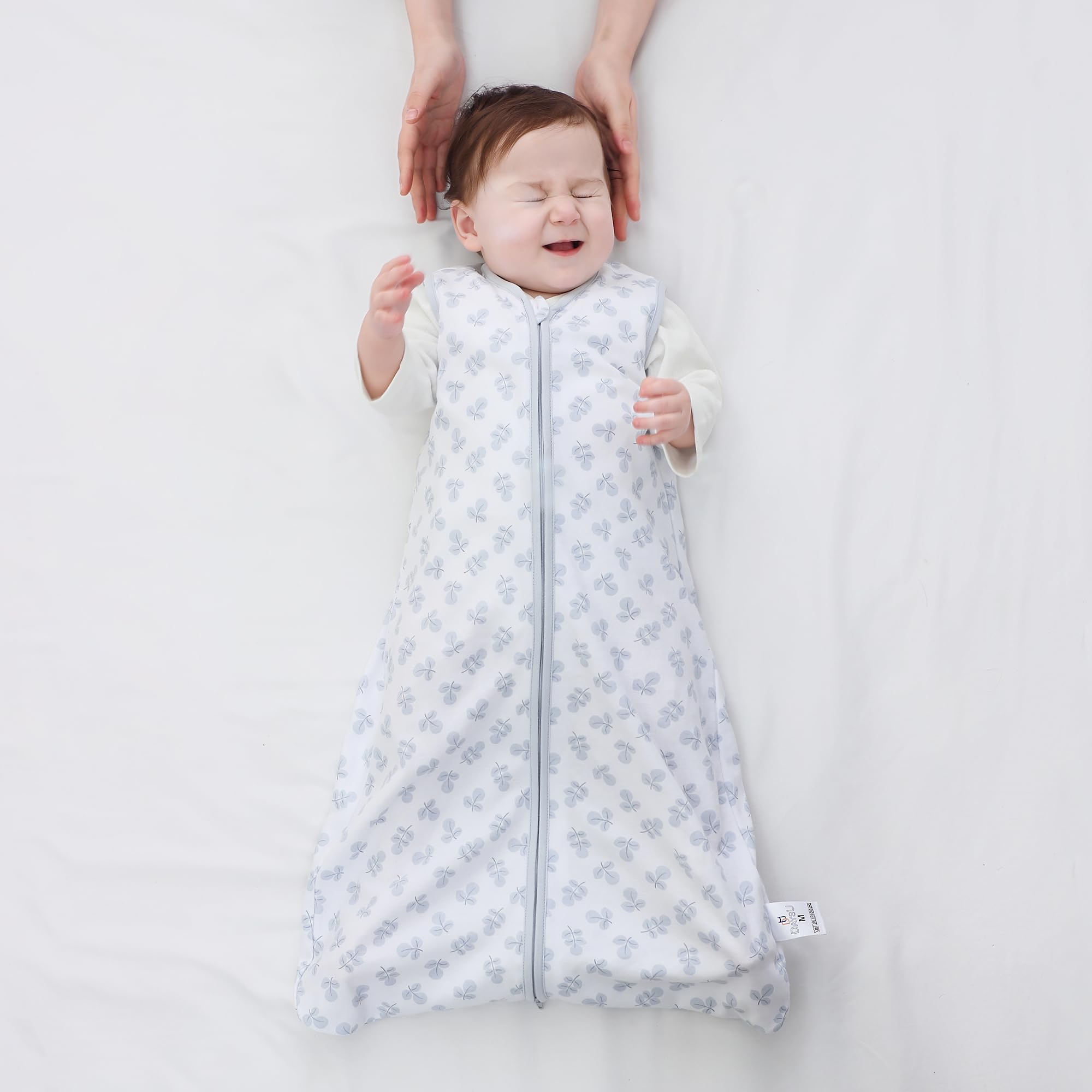 DaysU sleeveless wearable blanket keeps baby warm without overheating.