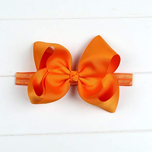 DDazzling orange bow headband close-up perfect for cute baby photos
