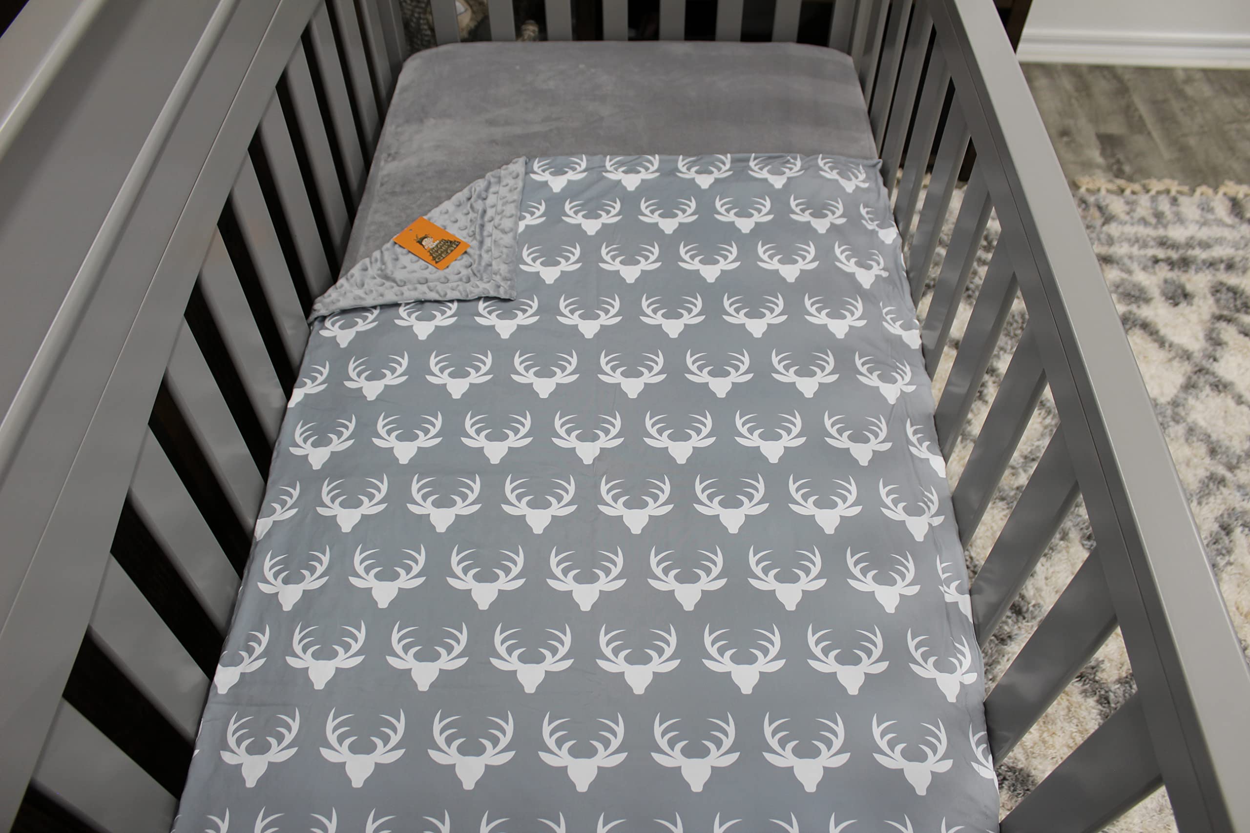 Dear Baby Gear antlers grey blanket, gender neutral design complements nursery.