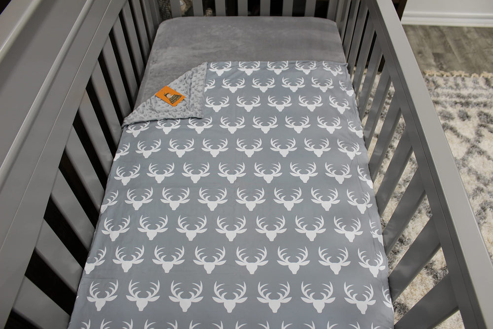 Dear Baby Gear antlers grey blanket, gender neutral design complements nursery.