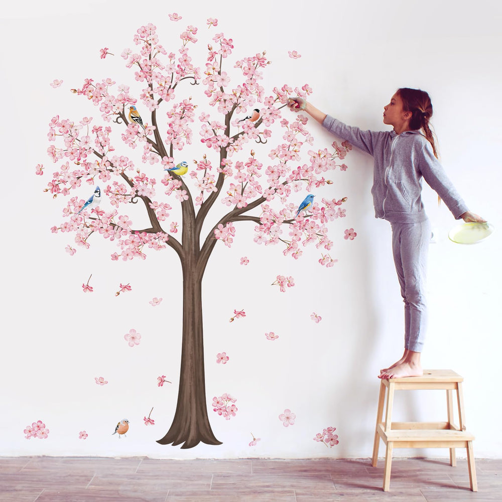 Decalmile pink blossom tree wall decal creates a whimsical focal point for any room.