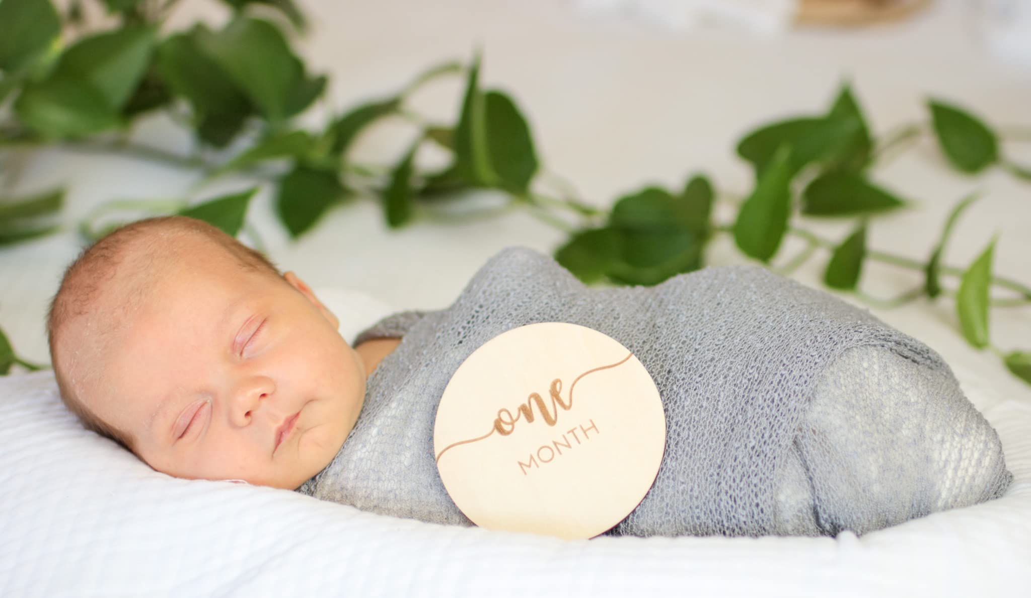 Declan and Delaney hello-world milestone sign for newborn arrival photos.
