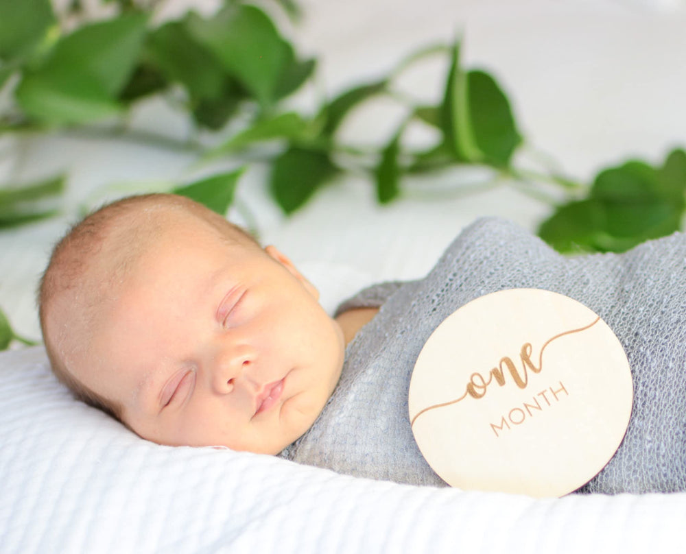 Declan and Delaney one-year milestone disc for final-year baby photos.