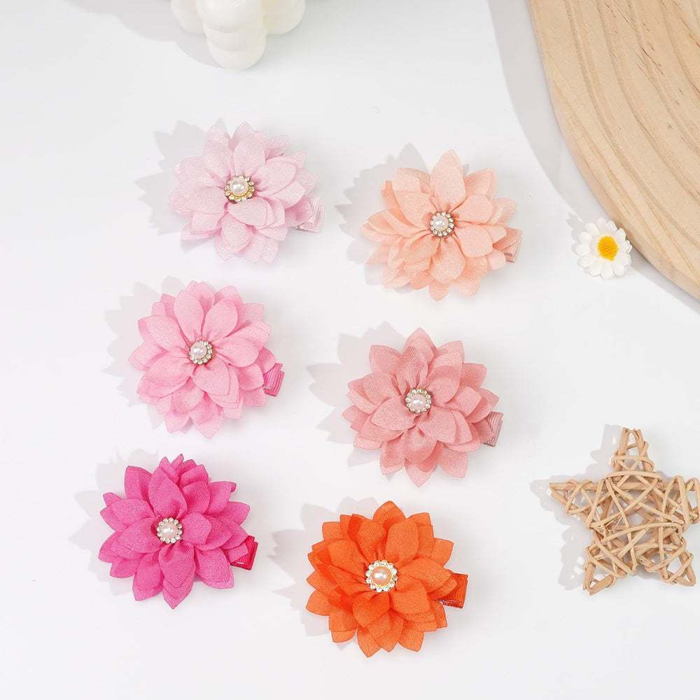 DED chiffon and grosgrain craftsmanship creates delicate, eye-catching accessories.