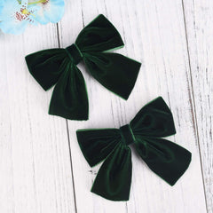DEEKA green bows on a little girl’s outfit for a cute look