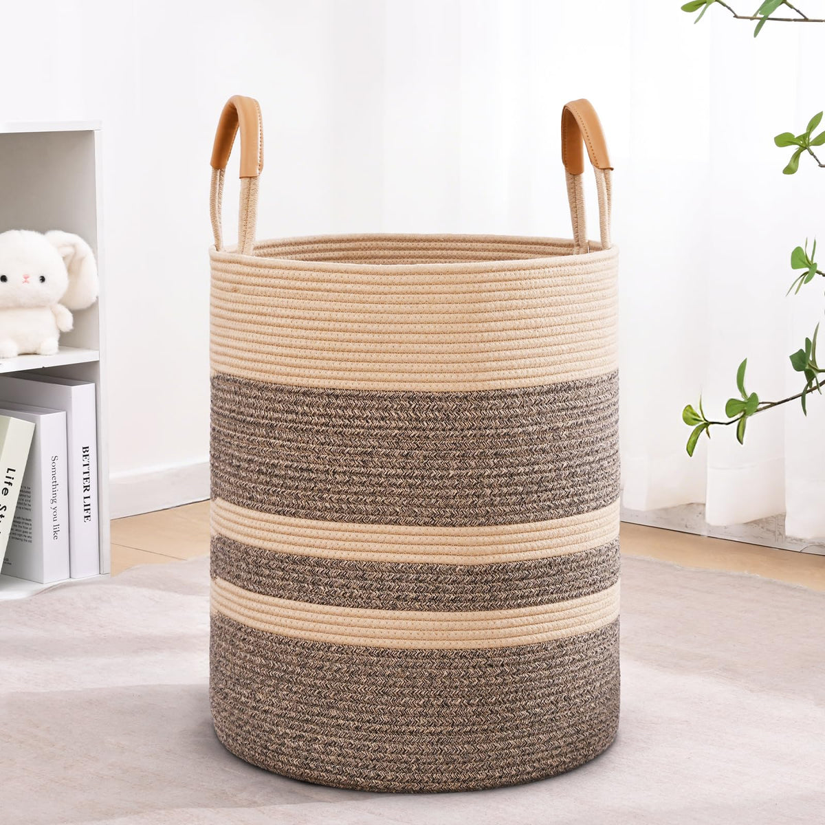 Degeyoyo 60L striped laundry basket with leather handles for easy transport.