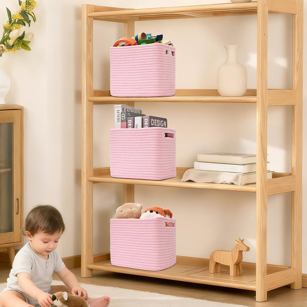 Degeyoyo pink cube storage bin in the bathroom for towels and toiletries.