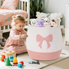 Degeyoyo pink basket holding blankets and toys in nursery for tidy organization