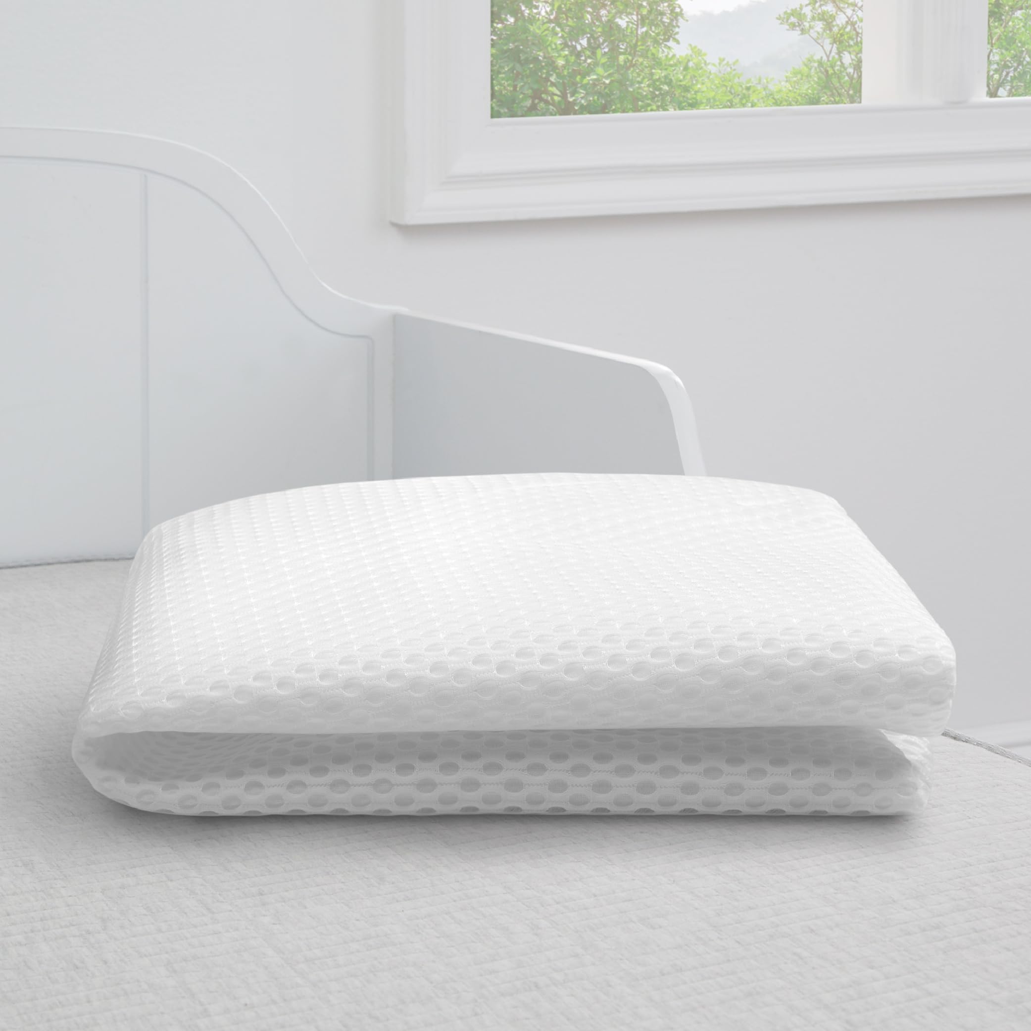 Noiseless Delta Children pad shown on crib for undisturbed sleep.