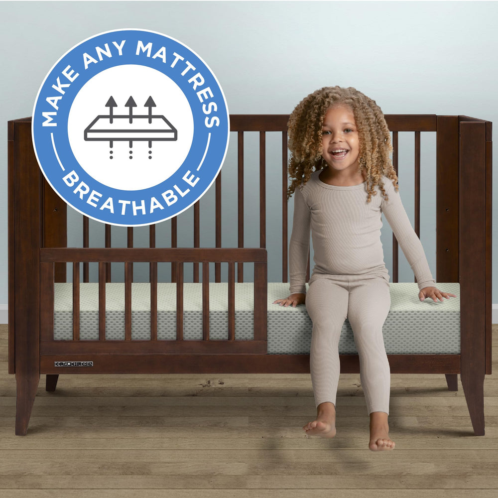Delta Children breathable crib mattress pad cover side view with secure elastic edges