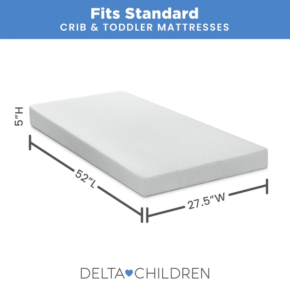 Soft, crinkle-free Delta Children pad resting softly on a crib.