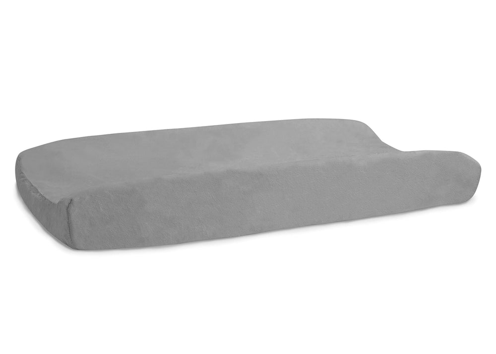 Delta Children contoured changing pad in grey in use on a dresser