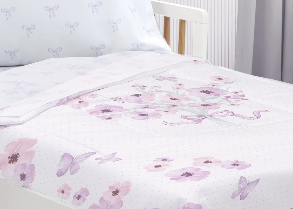 Delta Children purple bouquet bedding in a toddler bed setup
