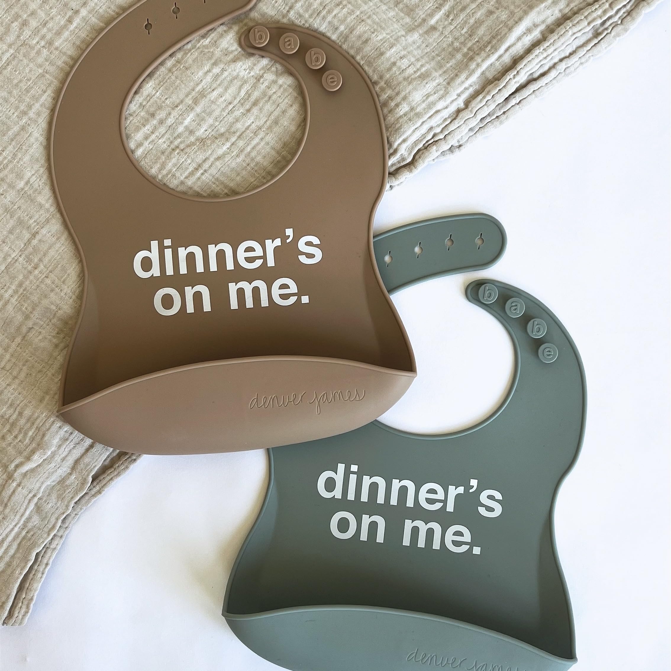 Denver James silicone feeding bib with adjustable closure fits growing babies.
