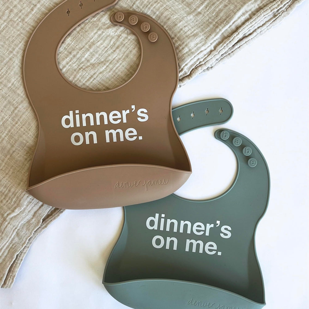 Denver James silicone feeding bib with adjustable closure fits growing babies.