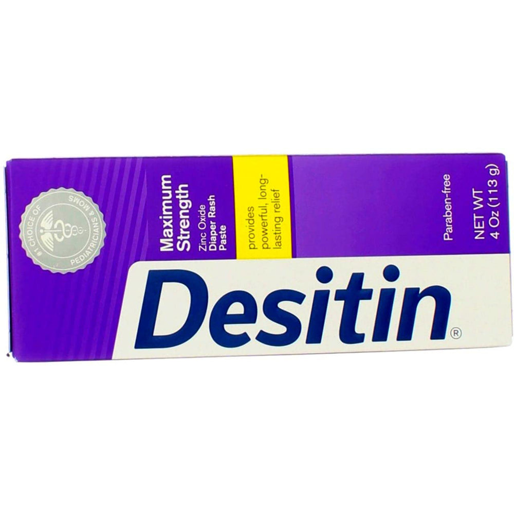 Desitin paste applied to baby skin during a diaper change