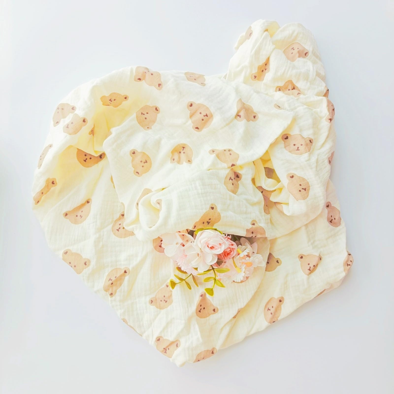 DEZIGKA muslin swaddle blanket in neutral color for versatile nurseries.