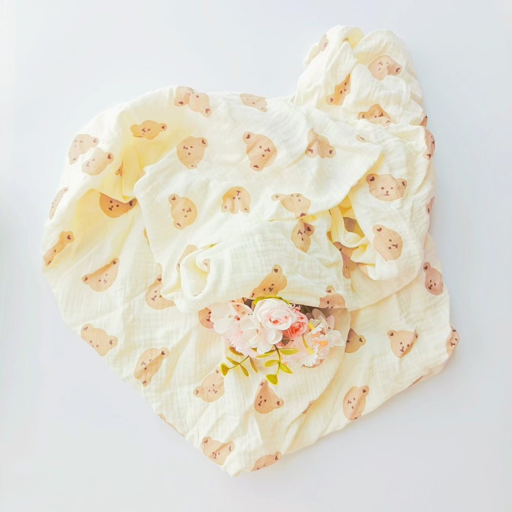 DEZIGKA muslin swaddle blanket in neutral color for versatile nurseries.