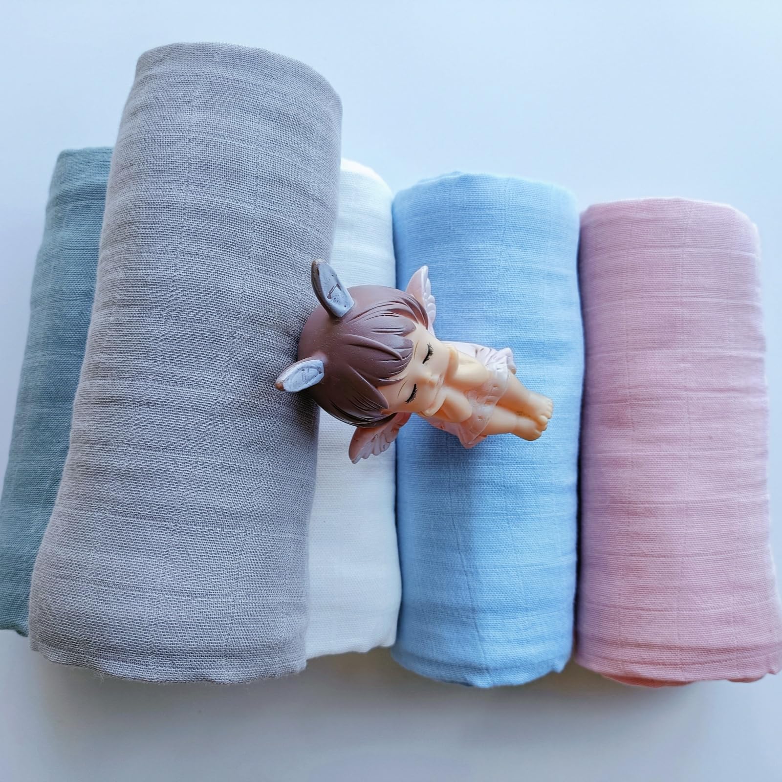 DEZIGKA soft sage green muslin texture highlights natural fabric feel.