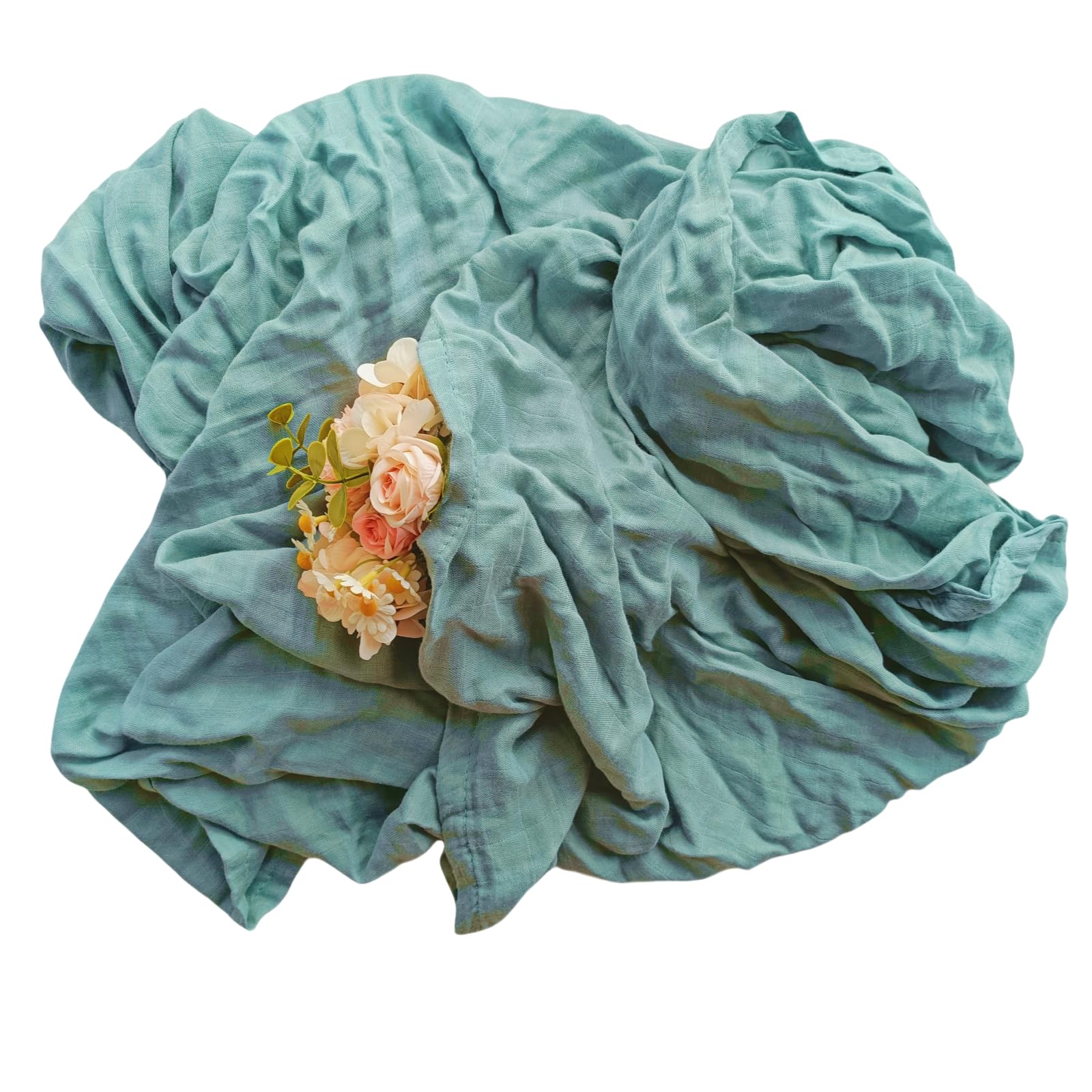 DEZIGKA swaddle laid on a play mat for tummy time practice.
