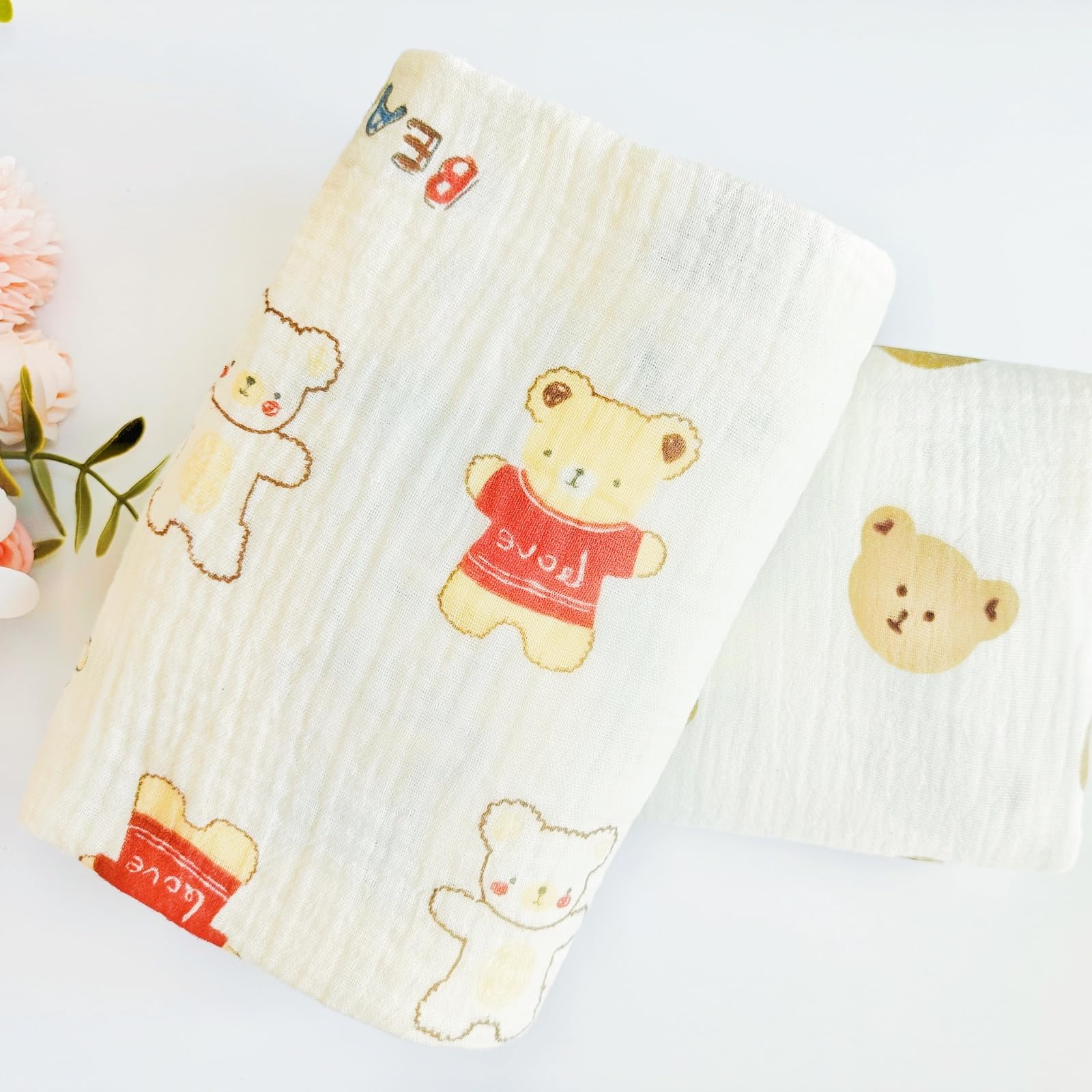 DEZIGKA muslin swaddle blanket breathable fabric suitable for year-round comfort.