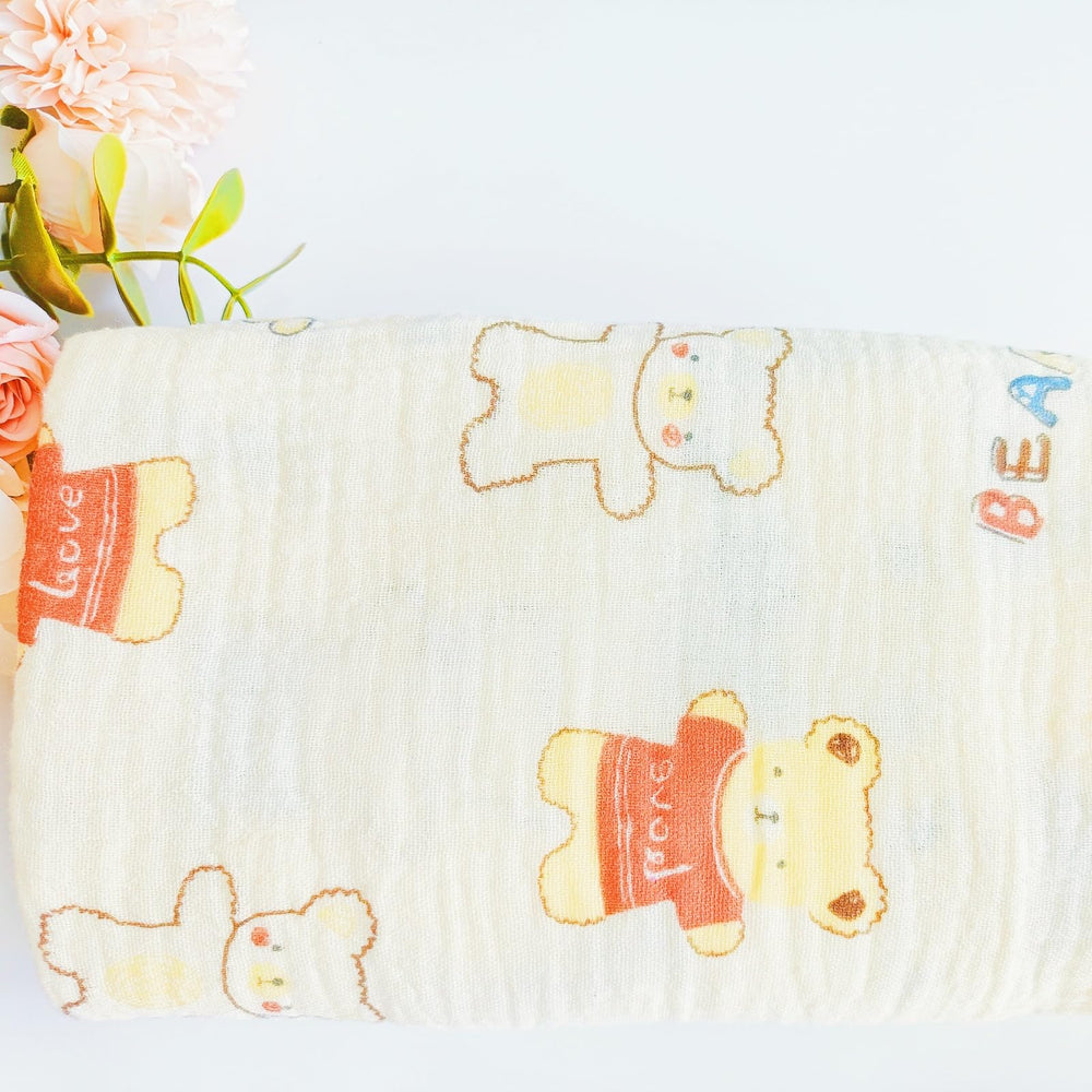 DEZIGKA muslin swaddle blanket stroller cover and sun shield for on-the-go days.