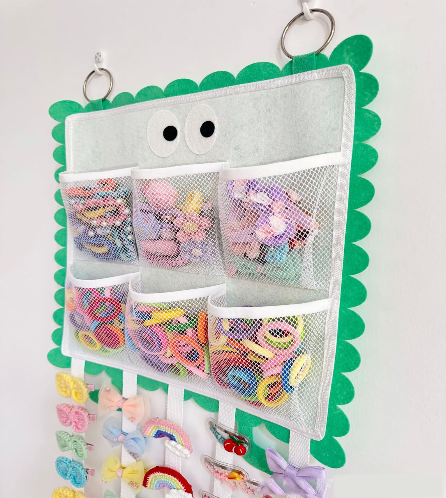 Green organizer helps keep scrunchies and clips tidy for easy styling