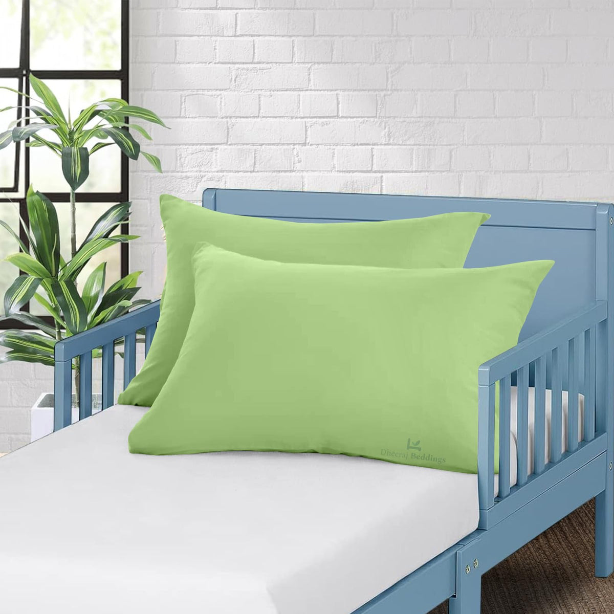 Dheeraj Beddings toddler travel pillow case in sage fits a 14x20 pillow for on-the-go comfort.