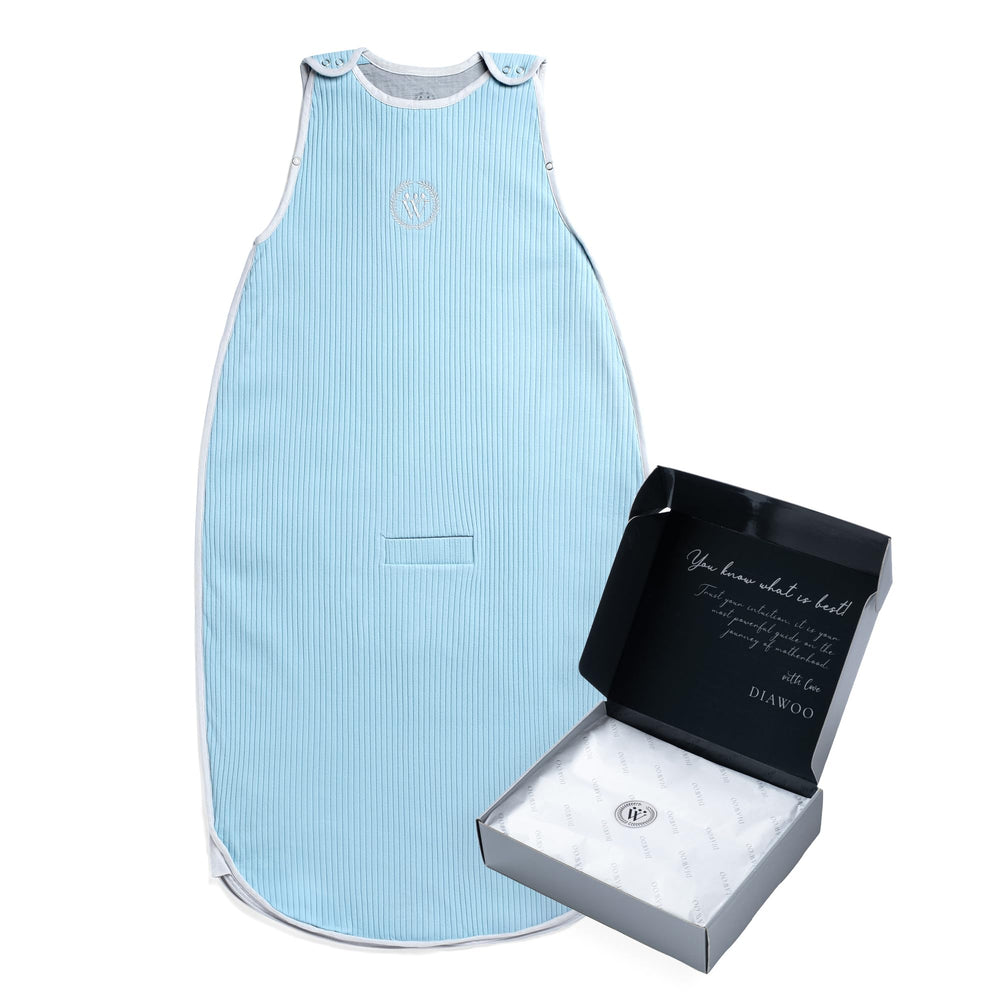 Diawoo cloud blue sleep sack shows breathable Merino warmth for year-round comfort.