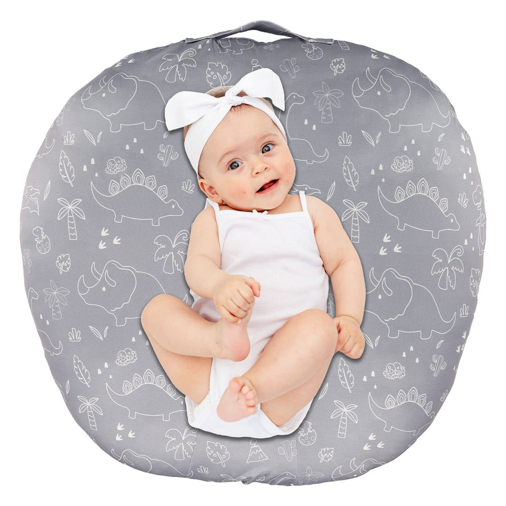 Dilimi newborn lounger cover with dinosaur pattern adds cozy nursery style.