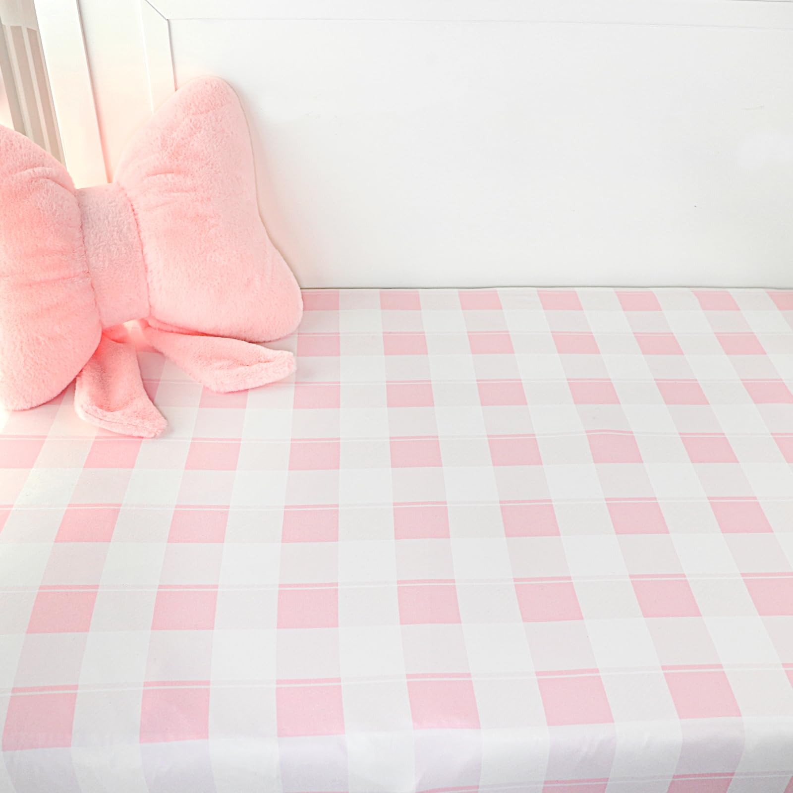DILIMI pink checkered crib sheet on baby bed for everyday use