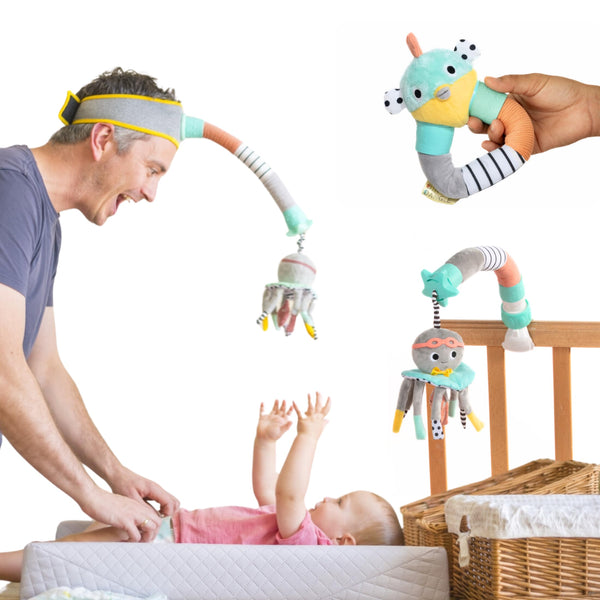 Dingle Dangle headband worn during diaper changes for a playful distraction