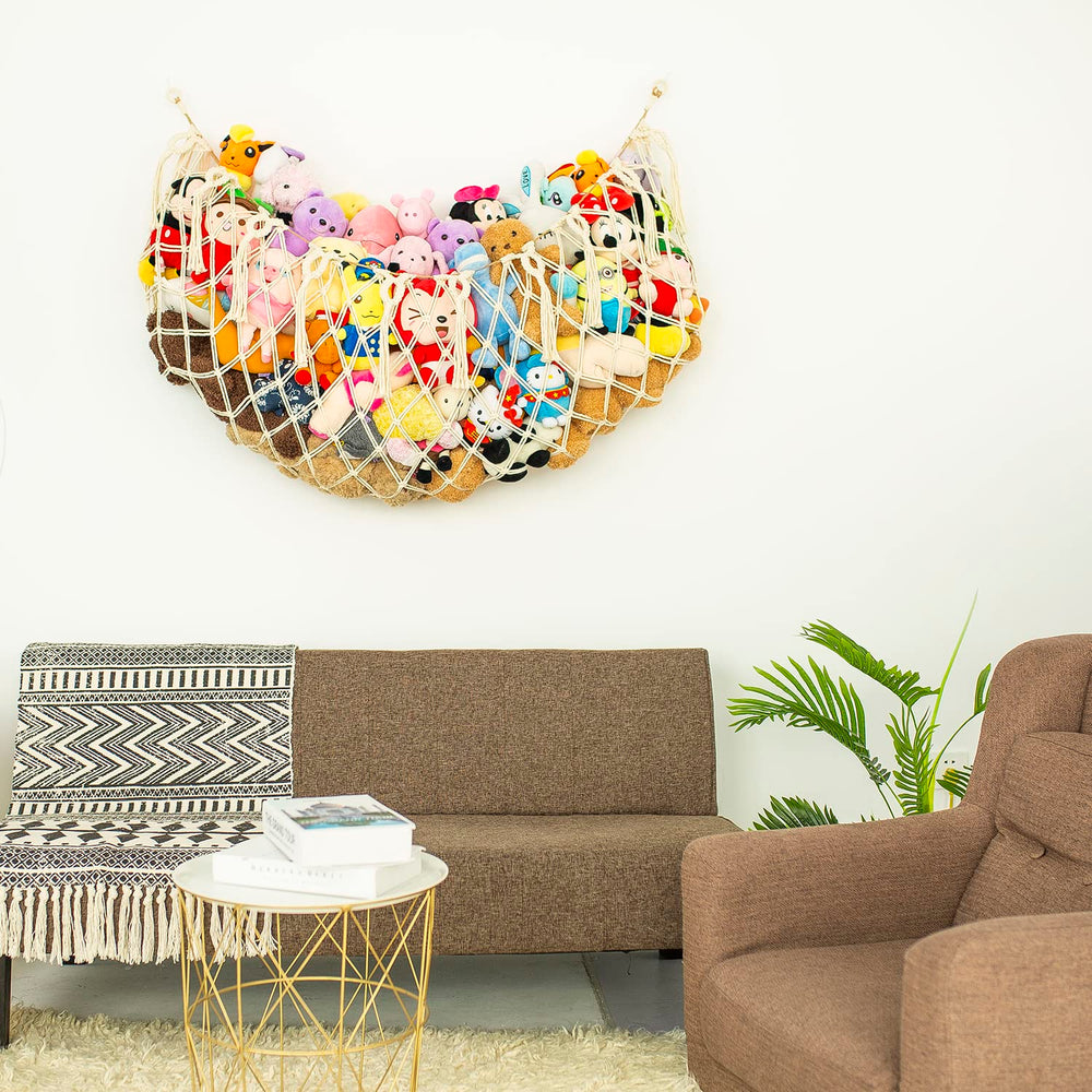 Diocos macrame toy hammock with wooden beads and tassels for decorative storage.