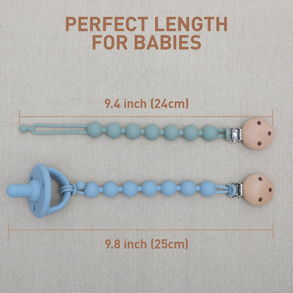 Dirbabi clip in use by baby secured to pacifier