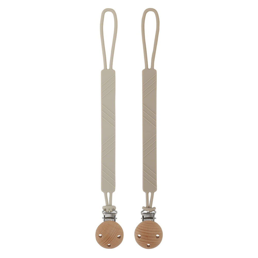 Dirbabi silicone pacifier clip holder in sand color keeps pacifier clean and close.