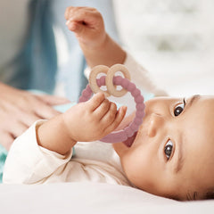 Dirbabi teether close up shows silicone and beech materials.