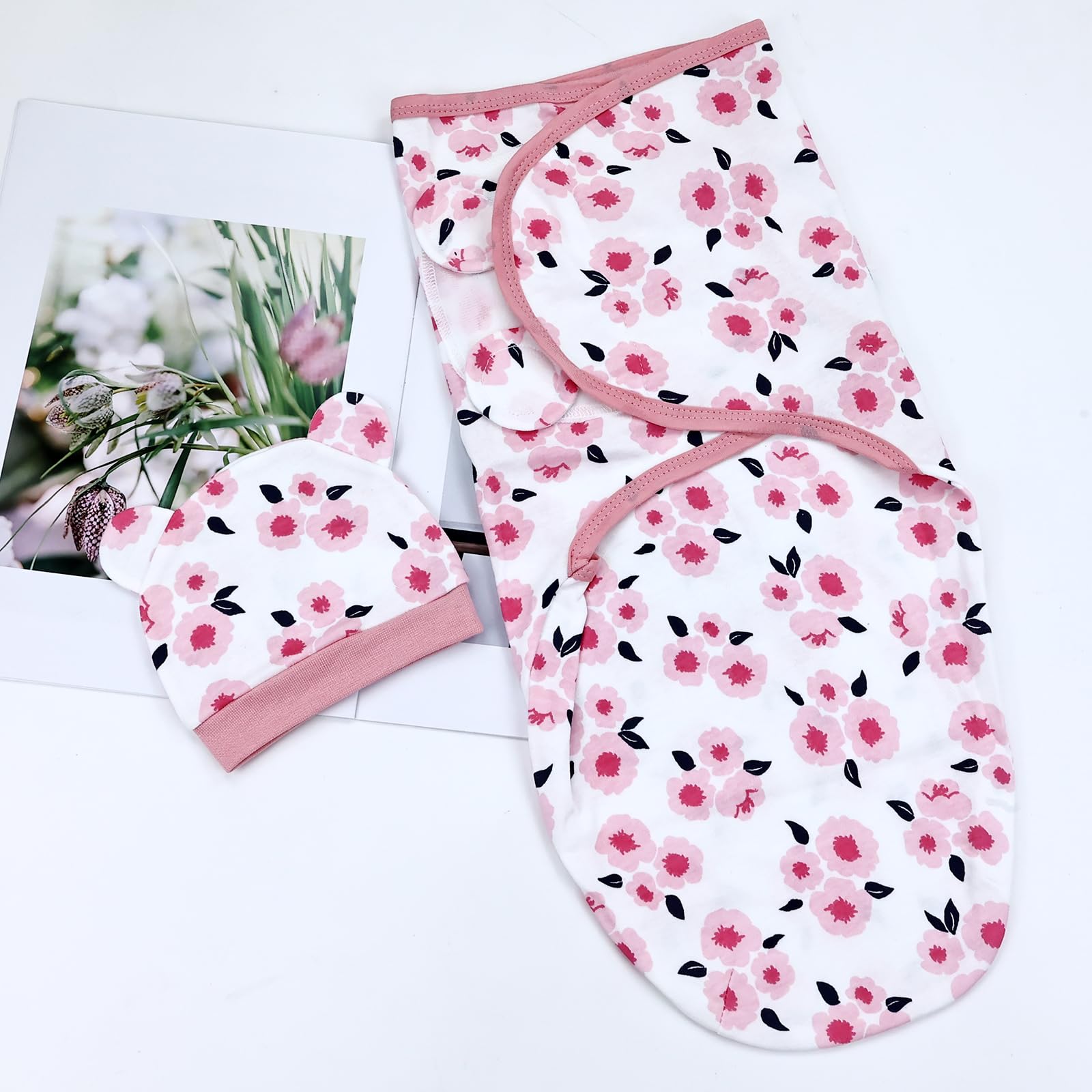 Dizila newborn photography setup with coordinated swaddle and hat.