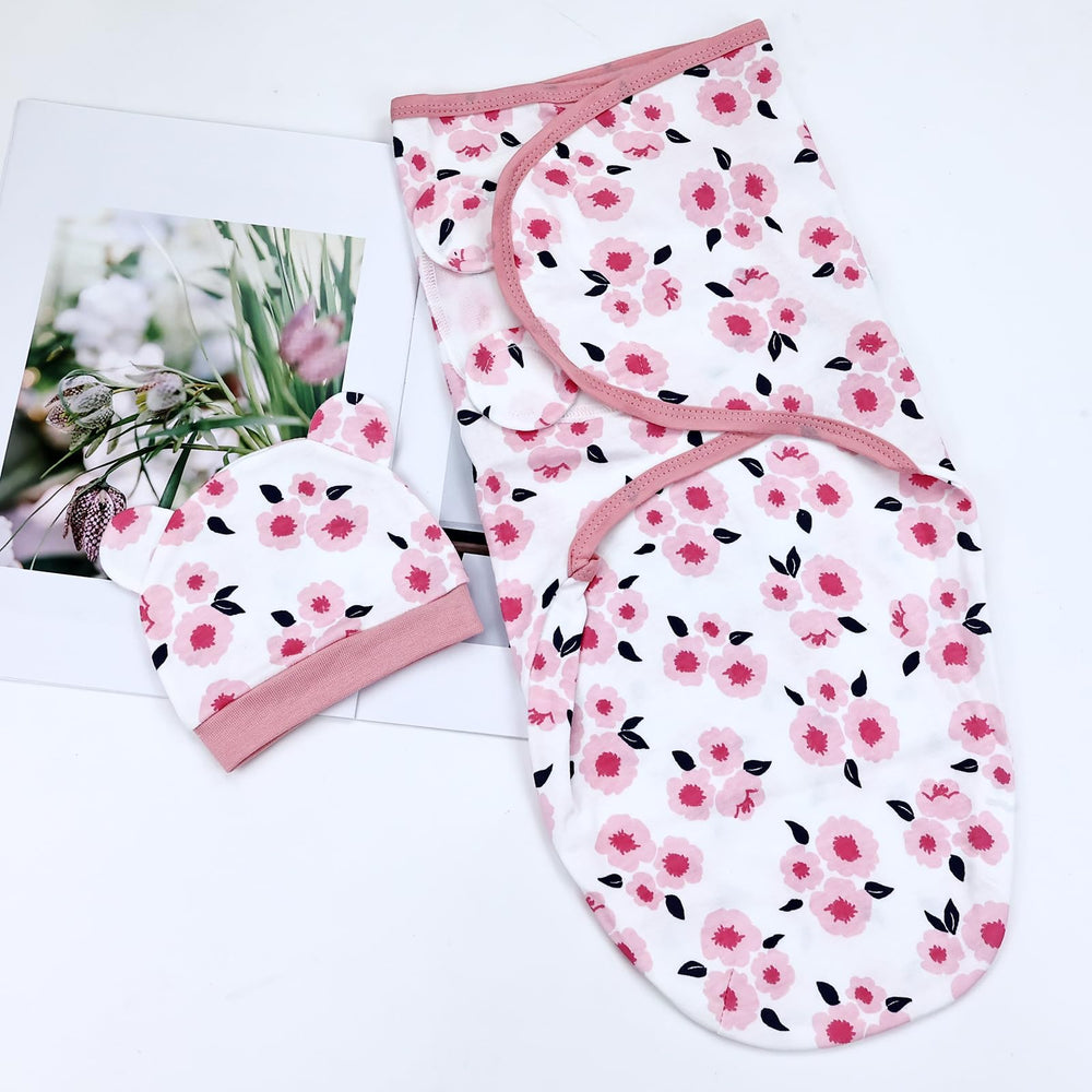 Dizila newborn photography setup with coordinated swaddle and hat.