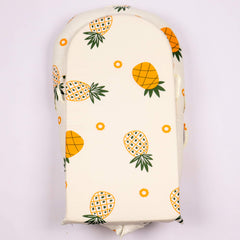 DockATot replacement cover with pineapple design is machine washable for easy care.